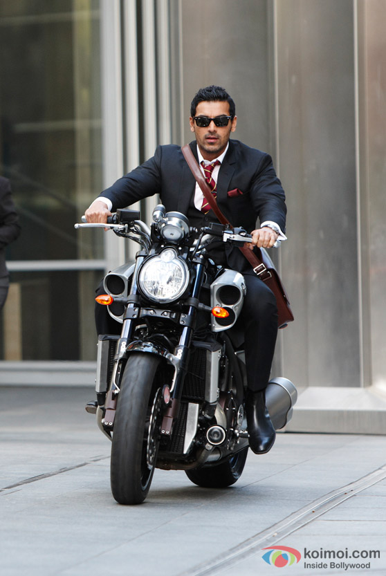 John Abraham rides a bike in Desi Boyz Movie