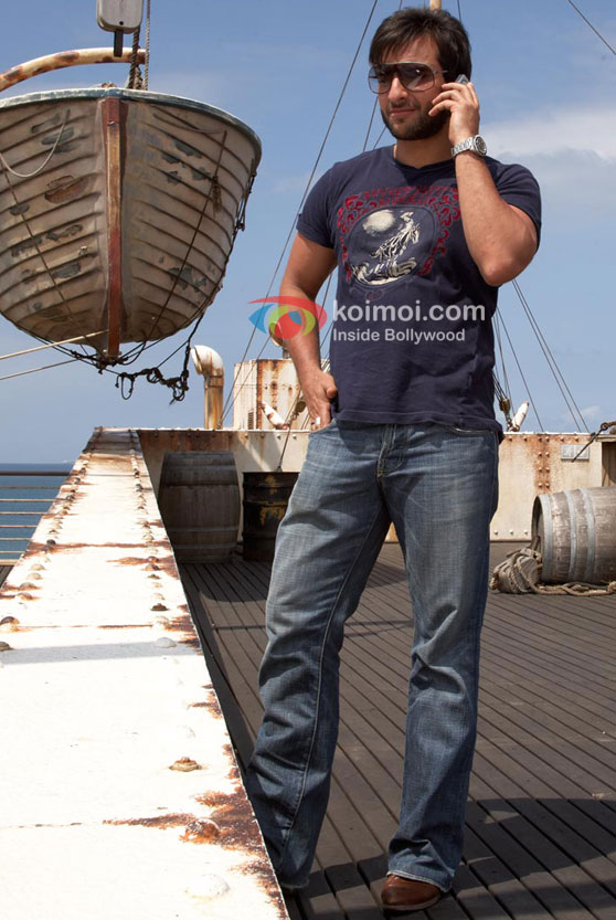 Saif Ali Khan talks on the phone in Race Movie