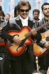 Rajnikanth strums the guitar in Sivaji - The Boss Movie