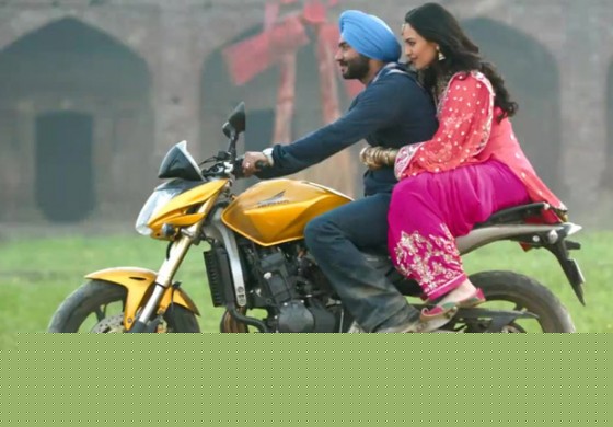 Ajay Devgan and Sonakshi Sinha on a bike in Son Of Sardar Movie Stills