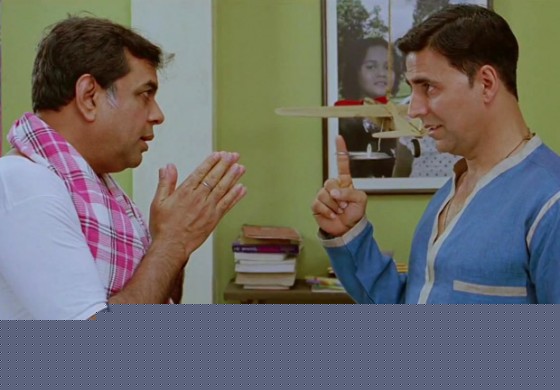 Paresh Rawal folding hands in front of God Akshay Kumar in OMG Oh My God Movie Stills
