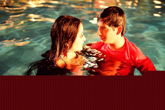 Raima Sen and Sharman Joshi in swiming pool in 3 Bachelors Movie Stills