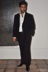 Karan Johar looks away