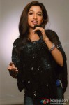 Shreya Ghoshal strikes a pose with a mic