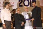 Pranab Mukherjee giving award to John Abraham