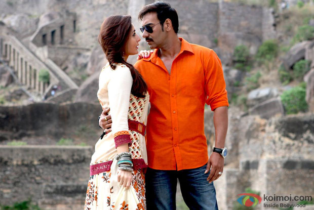 Kareena Kapoor and Ajay Devgn in a still from movie 'Singham Returns'