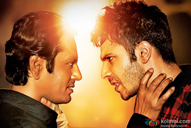 Nawazuddin Siddiqui and Varun Dhawan in a still from movie 'Badlapur'