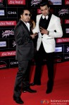 Mika Singh and Manish Paul during the GiMA Awards 2015