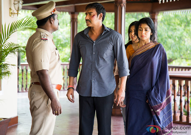 Ajay Devgn and Shriya Saran in a still from movie 'Drishyam'
