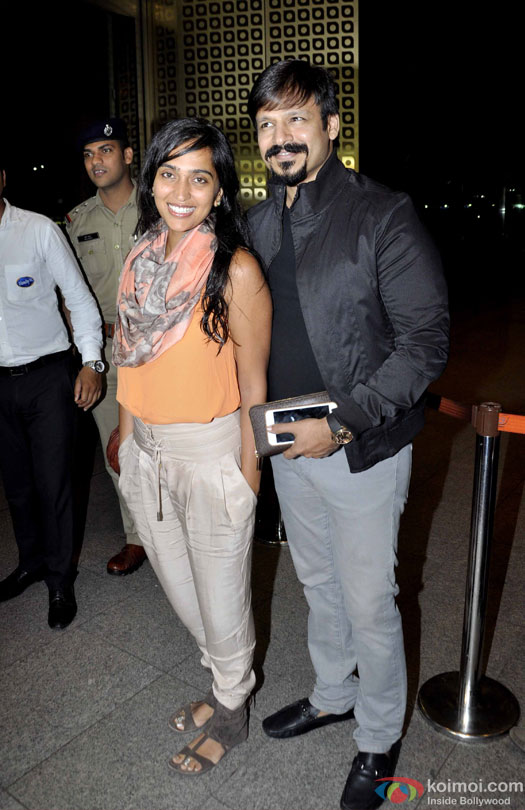 Priyanka Alva Oberoi and Vivek Oberoi at airport leave for IIFA 2016