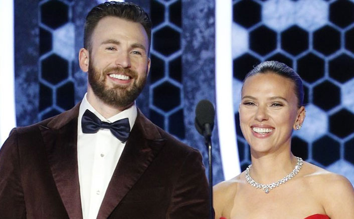 Captain America Saves The Day! Chris Evans Holds Scarlett Johansson with her dress at the Golden Globes