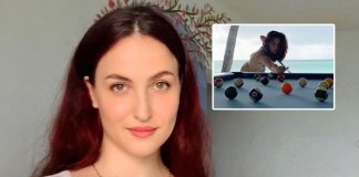 Elli AvrRam plays pool in bikini by the beach