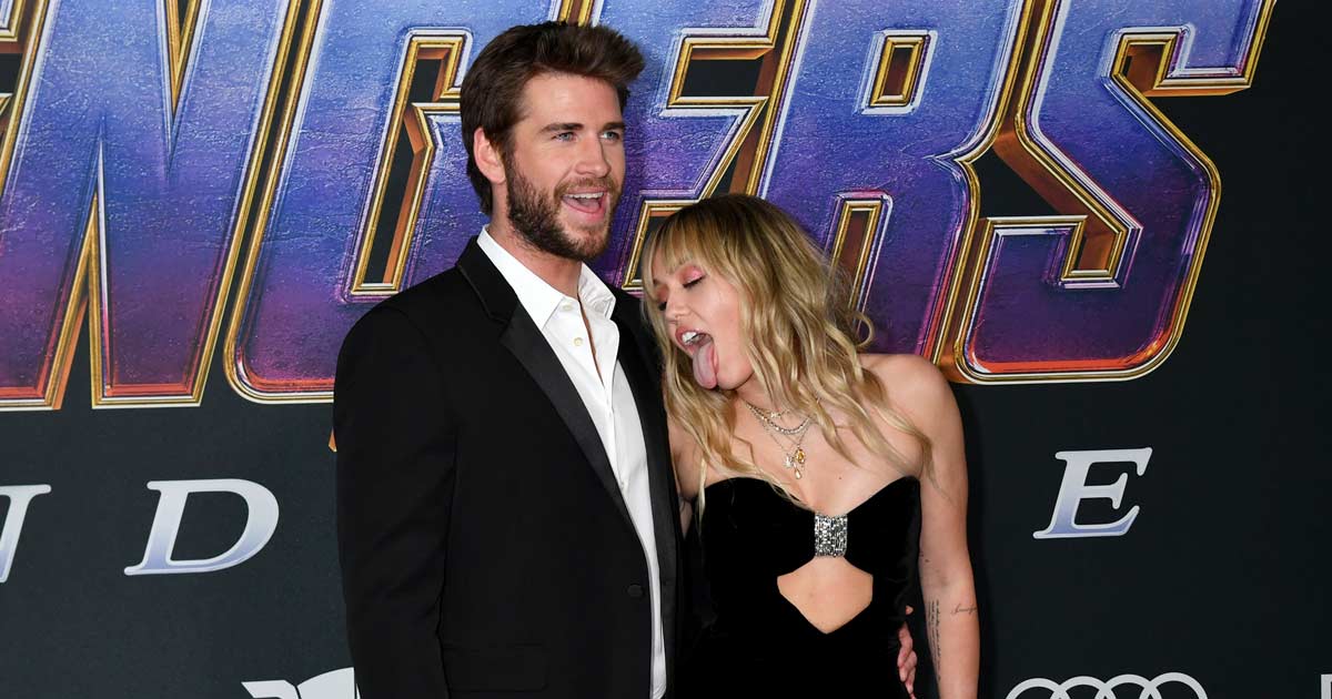 When Liam Hemsworth Reportedly Told Miley Cyrus, "Could You Behave For  Once?" After She Acted To Lick Him In Front Of The Media