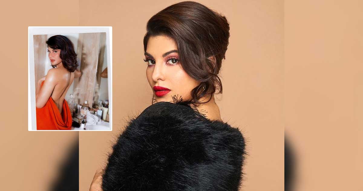 Jacqueline flaunts 'sexy back'