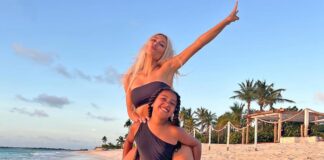 Kim gets a piggyback ride from daughter North during beach vacay
