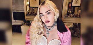 Madonna flashes bare bust in risque video after begging trolls to 'stop bullying' her