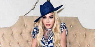 Madonna goes topless again after warning trolls to 'stop bullying' her after 50 Cent's dig