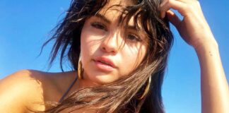 Selena Gomez Once Posed In A Cute Yellow Bikini That Exposed Her Assets Covered In Sand