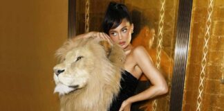 Kylie Jenner Turns Into A S*xy Huntress Dressed In A Figure-Hugging Black Dress With A Huge Lion's Head On Her Shoulders – Here’s How Netizens React