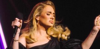 Adele tears up seeing man holding pic of his late wife at her concert