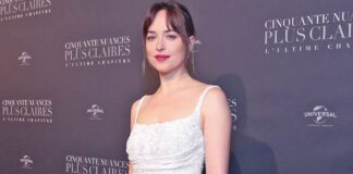 Dakota Johnson Once Shone Bright Like A Star In A White Seamless Slip Gown & Added A Touch Of Spice With Deep-V Neckline