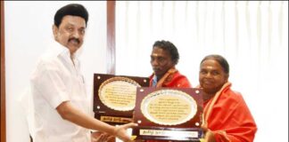 Stalin felicitates elephant whisperers Bomman and Bellie