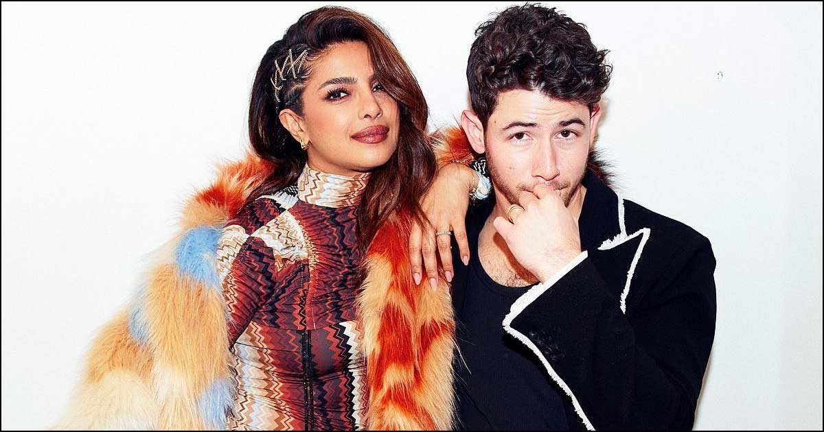 Priyanka Chopra Puts On A Busty Display In A Red Plunging Neckline Corset Gown Alongside Nick Jonas At The Premiere, Netizens React - See Video
