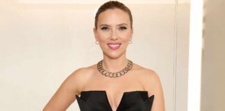 Scarlett Johansson Looked Like A Red Siren In This Mini Skirt & Sultry Top With A Plunging Neckline That Flashed Her B**bs