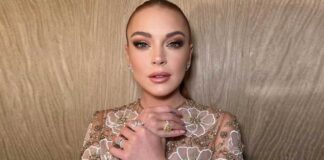 Lindsay Lohan shows off baby bump in swimsuit