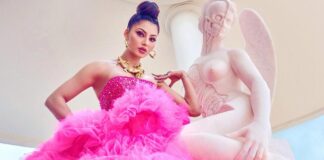 Urvashi's Cannes style: Necklace with intertwined alligators, pink Tulle gown