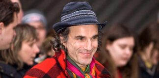Daniel Day-Lewis looks unrecognisable as he steps out with crutches, long grey hair