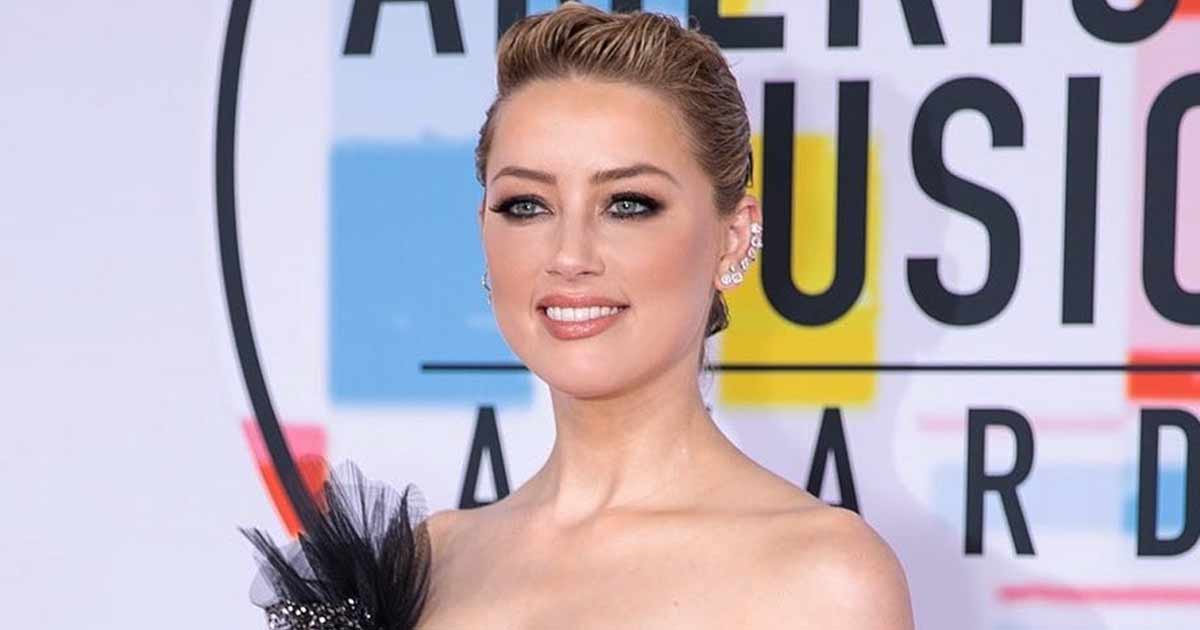 Amber Heard Once Looked Like The Queen Of Oceans By Donning A Sultry Blue Bodysuit With Plunging Neckline