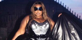 Lizzo removes skirt on-stage, slips into lace-up black leather bodysuit