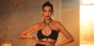 Nora Fatehi Gets Trolled For Carrying Tiniest Bag As She Flaunted Her Cl*avage In A S*xy Shimmery Saree, Netizen Say “Iss Ke Purse Mein Kya Hoga” Nora Fatehi Looks Gorgeous In A Shimmery Saree But Gets Trolled For Her Purse
