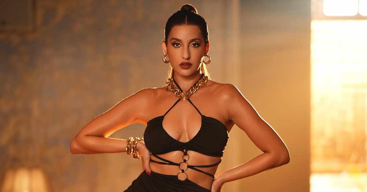 Nora Fatehi Looks Gorgeous In A Shimmery Saree But Gets Trolled For Her Purse