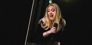 Adele helps couple announce their baby's gender on-stage