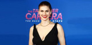Alexandra Daddario Once Leaned To Put Her B*sty Cl*avage On Display Through The Plunging Neckline Of A White Monokini