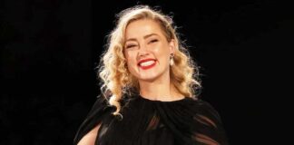 Amber Heard Steps Out In A Casual Black Dress, Uses Crutches To Walk In Spain
