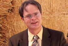 Rainn Wilson as Dwight Schrute in The Office, wearing a mustard shirt and glasses, almost missed out on the iconic role.