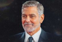 What Was The ‘George Clooney Effect’? Why Younger Women Are Drawn To Older Men George Clooney smiling at a red carpet event symbolizing the attraction younger women feel toward older men
