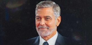 George Clooney smiling at a red carpet event symbolizing the attraction younger women feel toward older men