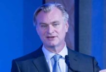 Why does Christopher Nolan have a strict no-phone policy while shooting?