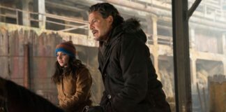 Abby And Lev Walking Through Burned City