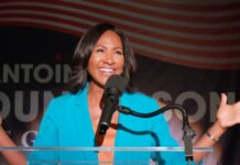 Actress Laughing During Political Satire Scene