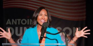Actress Laughing During Political Satire Scene