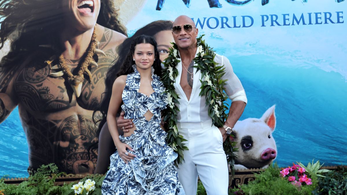 Dwayne Johnson Channels Maui With His Iconic Hook On The Blue Carpet
